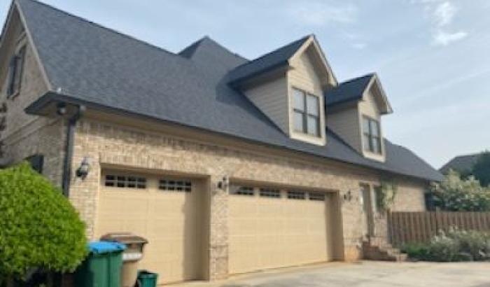 Side View Featuring Two Garage Doors